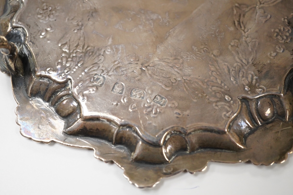 A George III silver waiter, John Cox, London, 1771, of shaped circular form, with later decoration, on three hoof feet, 16.7cm, 7.2oz.
